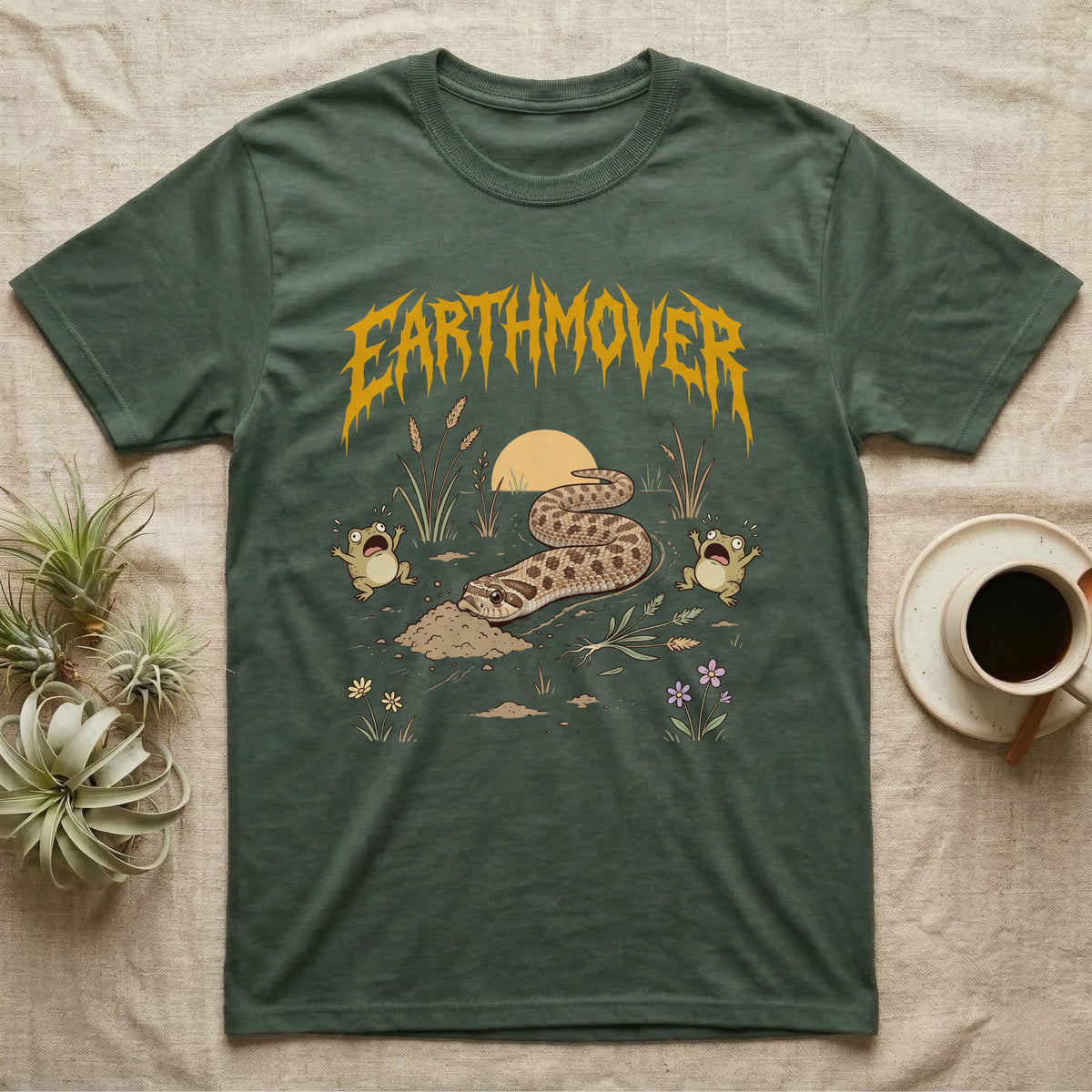 Western Hognose Earthmover T-Shirt in Military Green — Western hognose snake bulldozing a mound of dirt as two frogs scream, under dripping EARTHMOVER lettering with a low sun and wildflowers.