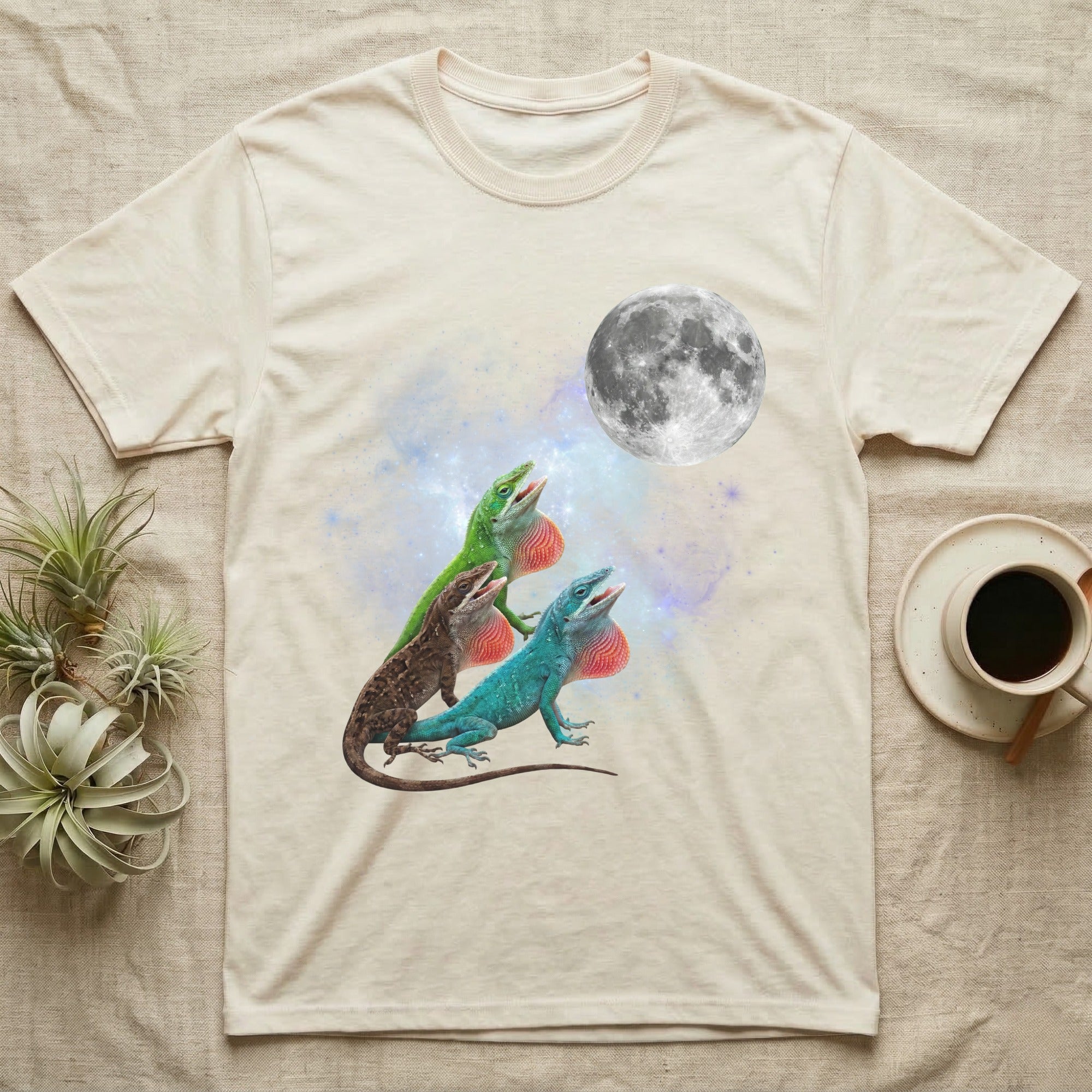 Green Anole Moon Howl T-Shirt in Natural — Three Green Anole colour morphs howling at a full moon over a nebula on a dark grey t-shirt.