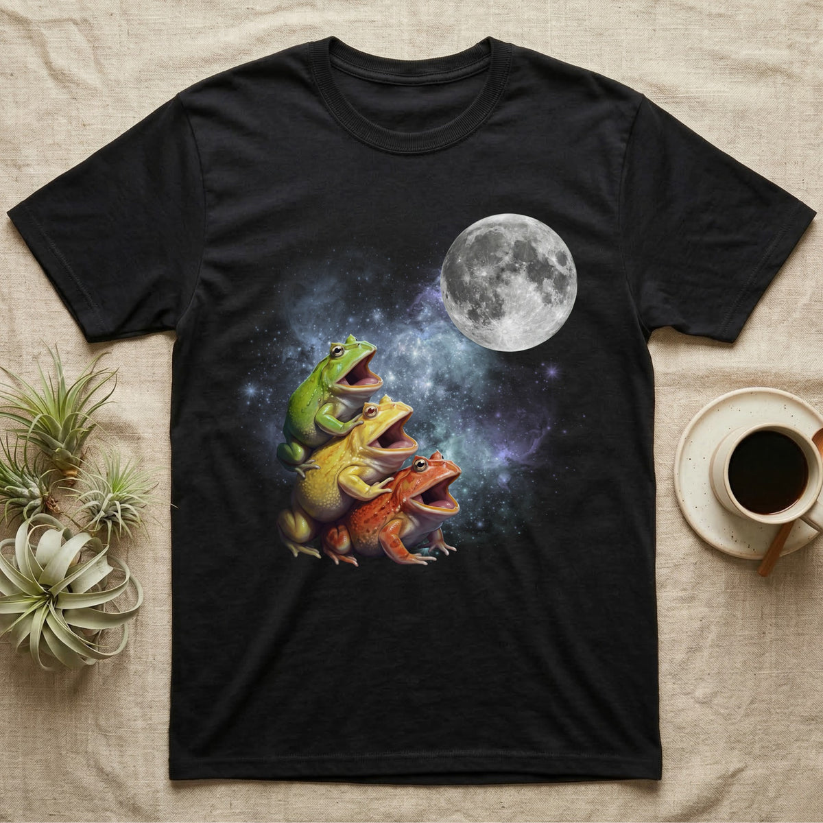 Pacman Frog Moon Howl T-Shirt in Black — Three Pacman Frog colour morphs howling at a full moon over a nebula on a dark grey t-shirt.