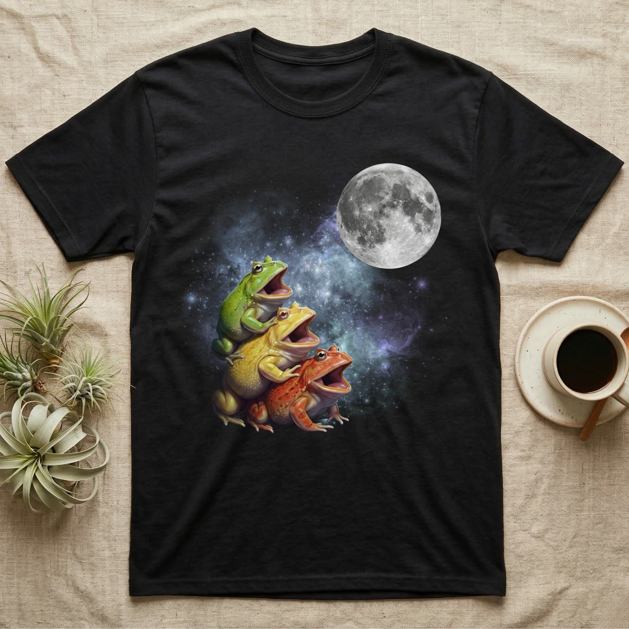 Pacman Frog Moon Howl T-Shirt in Black — Three Pacman Frog colour morphs howling at a full moon over a nebula on a dark grey t-shirt.