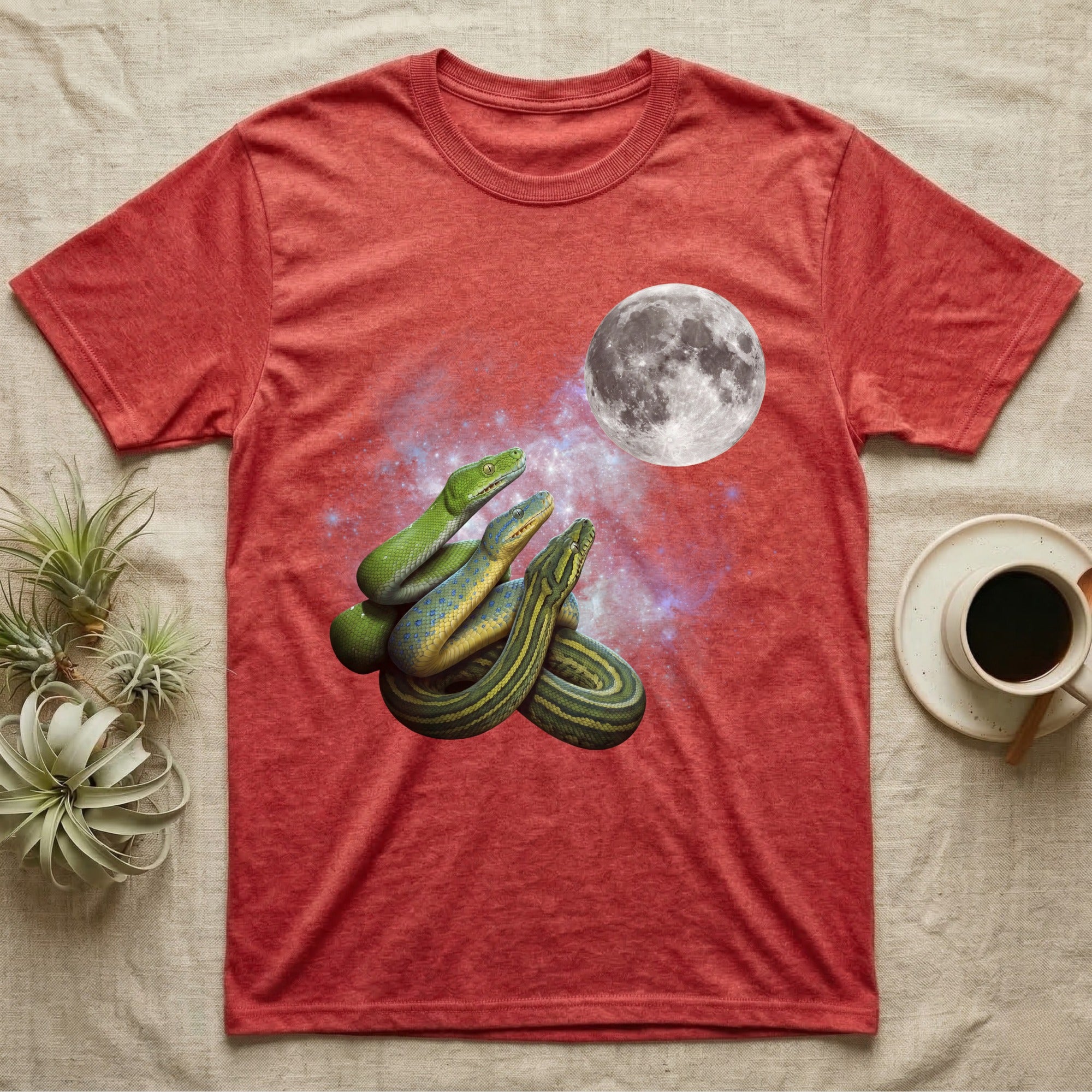 Green Tree Python Moon Howl T-Shirt in Heather Red — Three Green Tree Python colour morphs howling at a full moon over a nebula on a dark grey t-shirt.