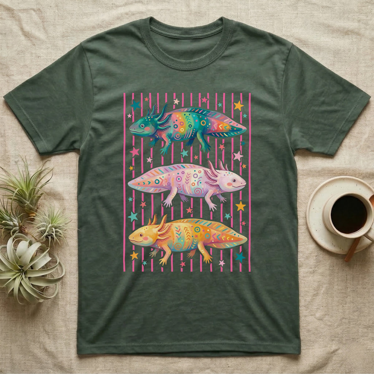 Axolotl Colourways Candy Stripe T-Shirt in Military Green — Three gouache axolotls stacked in bands on pink candy stripes, facing left, right and left, with scattered stars
