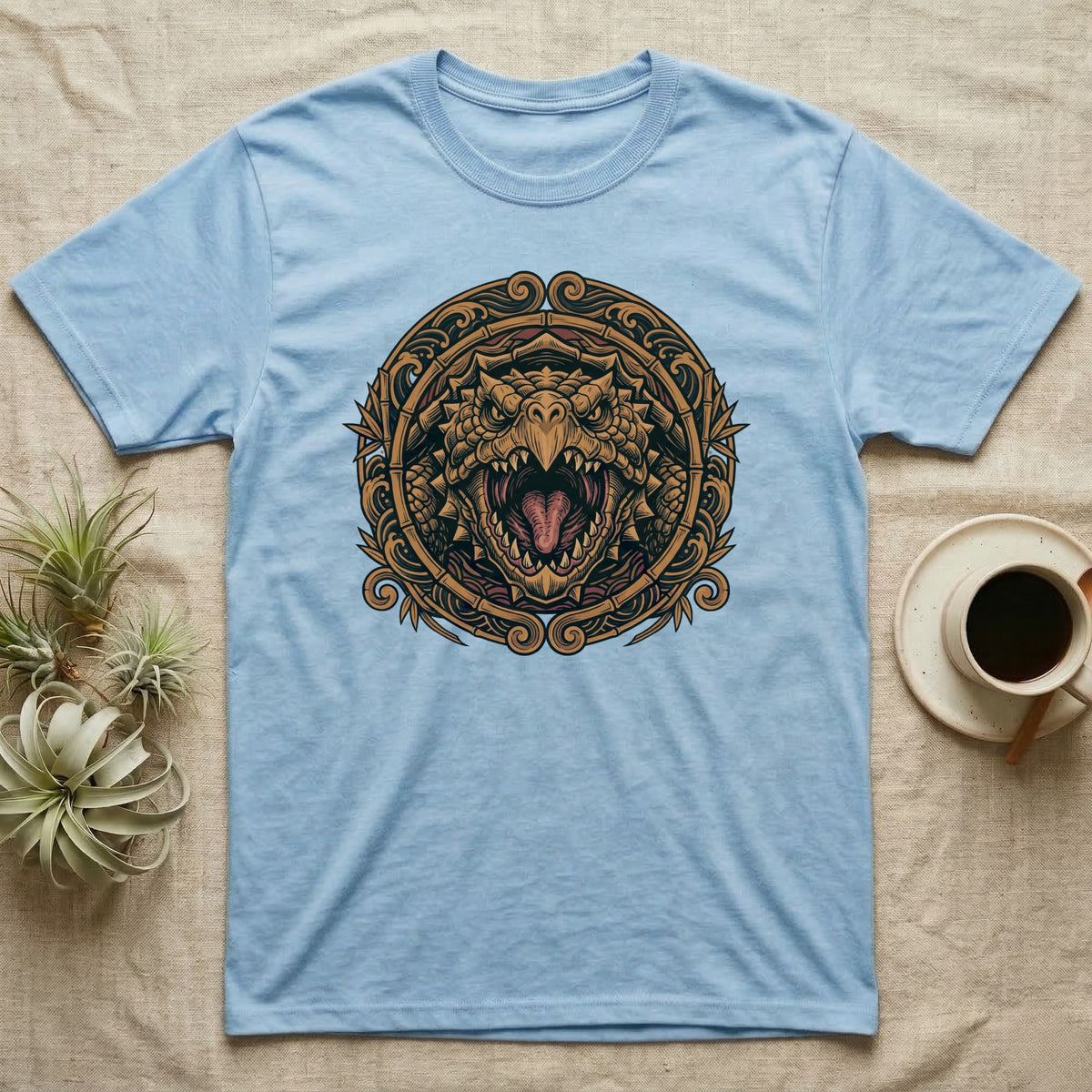 Light blue t-shirt with a circular, ornate dragon head design.
