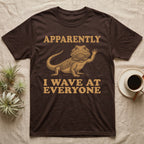 Bearded Dragon Engraving T-Shirt in Dark Chocolate — Antique green engraving of a bearded dragon raising one arm between the words APPARENTLY and I WAVE AT EVERYONE