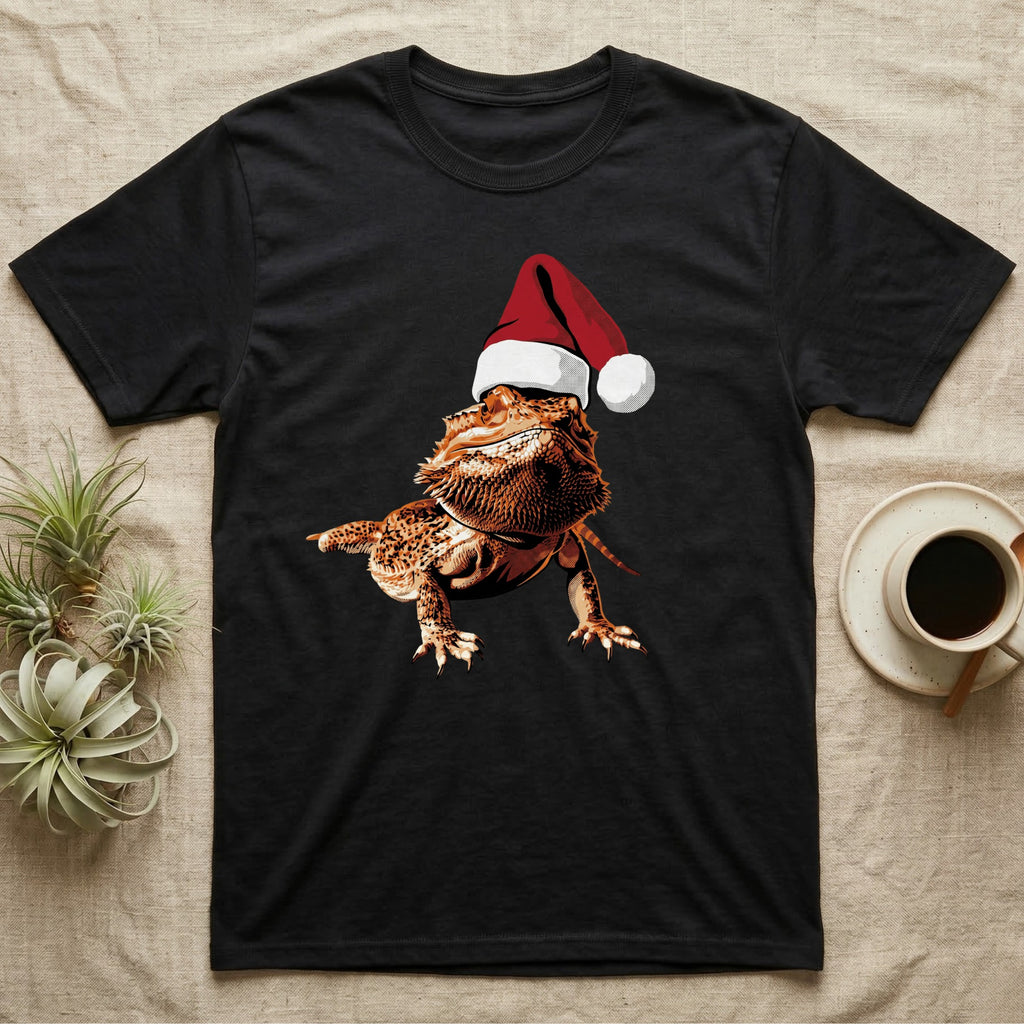 Vintage comic illustration of a bearded dragon wearing a red and white Santa hat, graphic-only, no text. — shown on a Black tee.