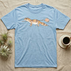 African Fat-Tailed Gecko Watercolour T-Shirt in Light Blue — Watercolour African fat-tailed gecko in profile beneath a thin twig ending in a soft bloom, drawn with a broken ink line.