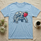 Sulcata Strawberry Tortoise T-Shirt in Light Blue — Bold vector illustration of a sulcata tortoise lunging neck-first toward an oversized red strawberry, head-on view.