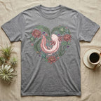 Grey t-shirt with pink axolotl heart design surrounded by flowers and leaves.