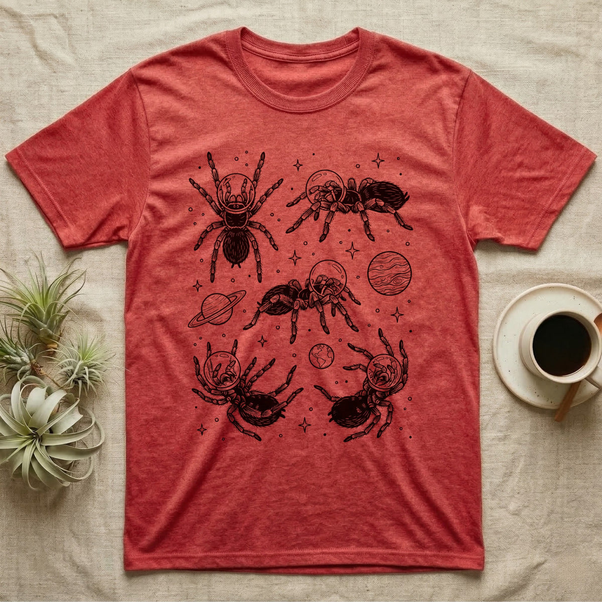 Tarantula Cosmic T-Shirt in Heather Red — Vintage screen-print illustration of tarantulas in astronaut helmets floating in space, obsidian black monochromatic on dark grey background.