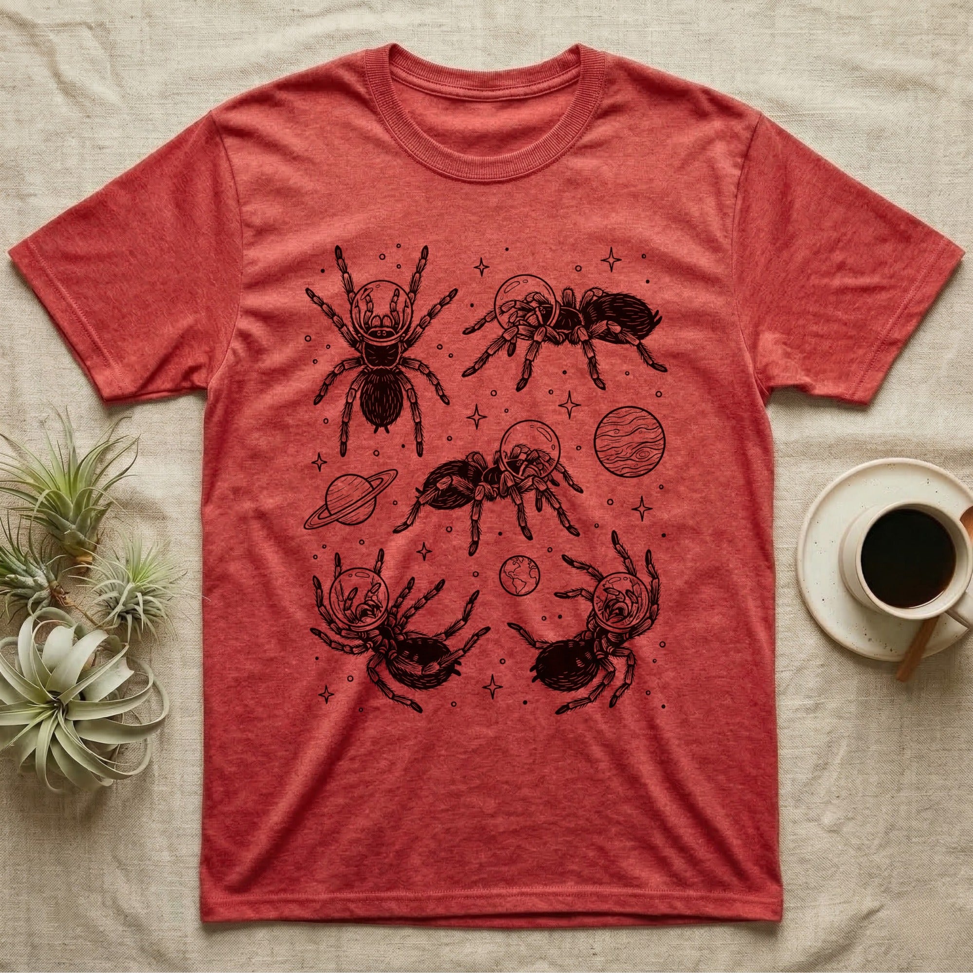 Tarantula Cosmic T-Shirt in Heather Red — Vintage screen-print illustration of tarantulas in astronaut helmets floating in space, obsidian black monochromatic on dark grey background.