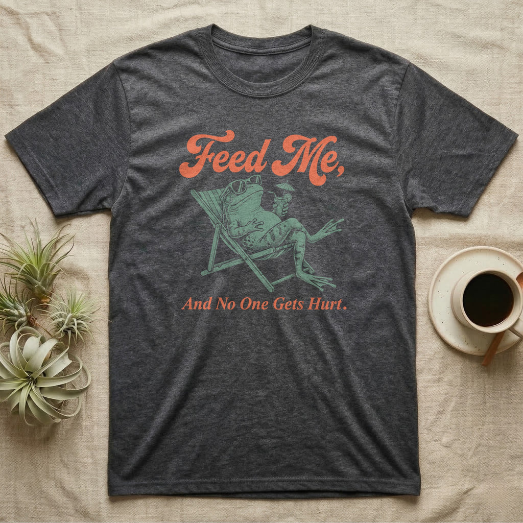 American Bullfrog Beach Chair T-Shirt in Dark Heather — Illustrated American bullfrog lounging in a beach chair with sunglasses and a tropical drink, coral script reading Feed Me And No One Gets Hurt.