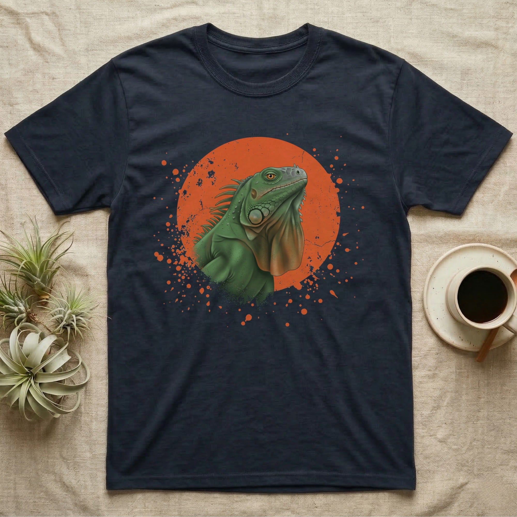 Green Iguana Stink Face T-Shirt in Navy — Distressed vintage-style illustration of a green iguana with its dewlap fully dropped and chin lifted, on an orange disc.