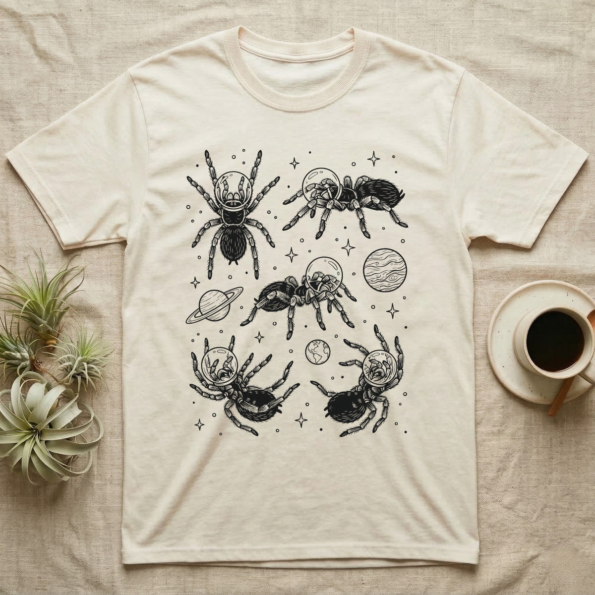Tarantula Cosmic T-Shirt in Natural — Vintage screen-print illustration of tarantulas in astronaut helmets floating in space, obsidian black monochromatic on dark grey background.
