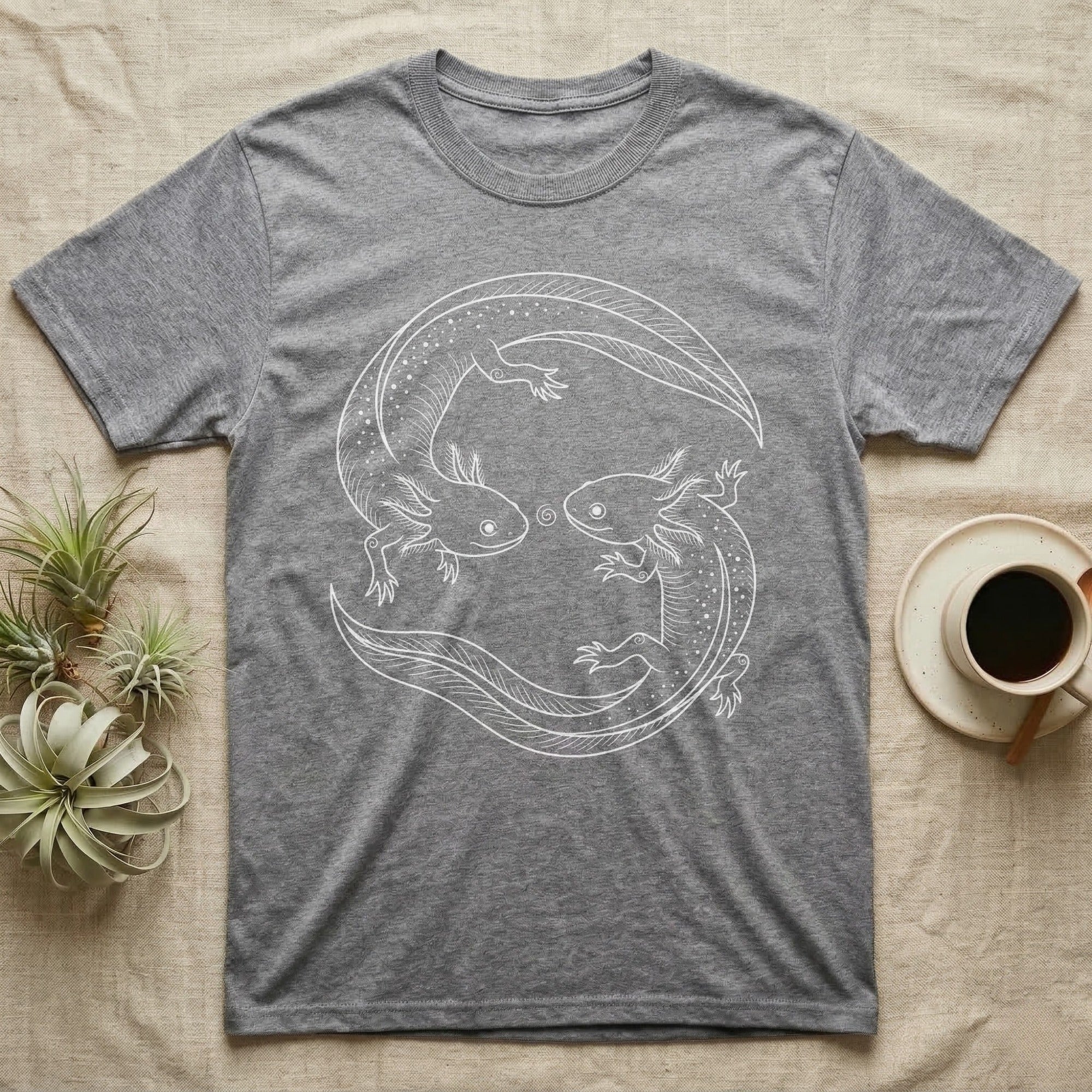 Axolotl Pair Roundel T-Shirt in Sport Grey — Fine-line drawing of two axolotls in a rotational roundel, heads meeting over a small spiral on grey