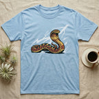 Light blue t-shirt with cobra graphic and lightning bolts.