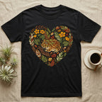 Black t-shirt with a heart-shaped graphic of a frog surrounded by leaves and stones.