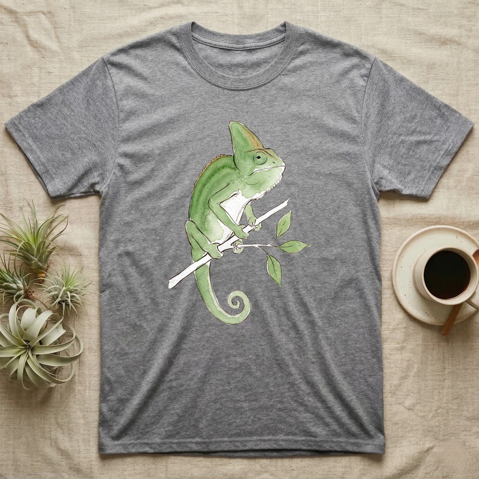 Veiled Chameleon Ambassador T-Shirt in Sport Grey — Watercolour illustration of a veiled chameleon calmly gripping a slender branch, tall casque and curled tail.