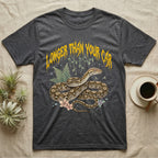 Reticulated Python Feral T-Shirt in Dark Heather — Reticulated python in net-patterned coils under jagged molten-gold metal text LONGER THAN YOUR CAR with pastel ferns