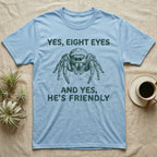 Jumping Spider Eight Eyes T-Shirt in Light Blue — Engraved jumping spider head-on with large forward eyes, between stitch-look lettering on grey.