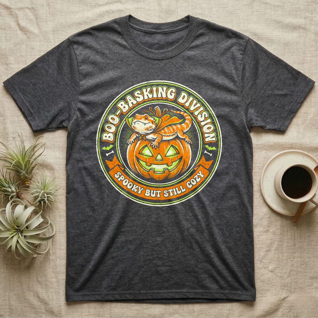 Bearded Dragon Boo-Basking T-Shirt in Dark Heather — Retro badge of a caped bearded dragon on a green-glowing pumpkin, "Boo-Basking Division, Spooky But Still Cozy."
