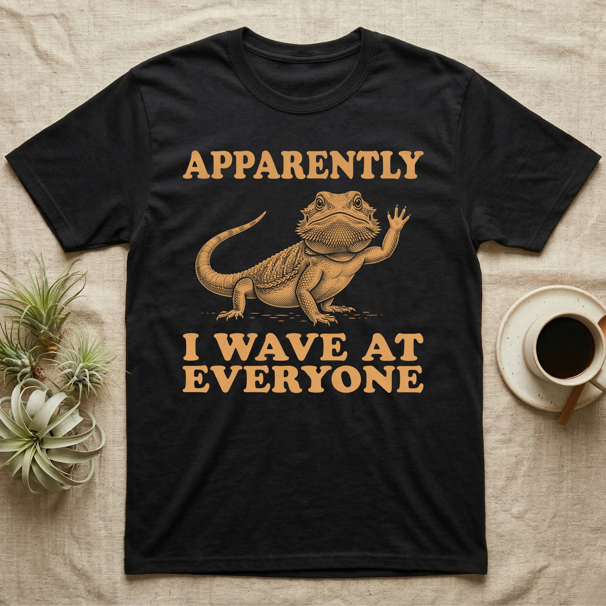 Bearded Dragon Engraving T-Shirt in Black — Antique green engraving of a bearded dragon raising one arm between the words APPARENTLY and I WAVE AT EVERYONE
