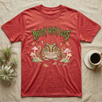 Pacman Frog Feral T-Shirt in Heather Red — Round Pacman frog in a pastel forest-floor scene under a spiky leaf-green metal wordmark reading MOUTH WITH LEGS.