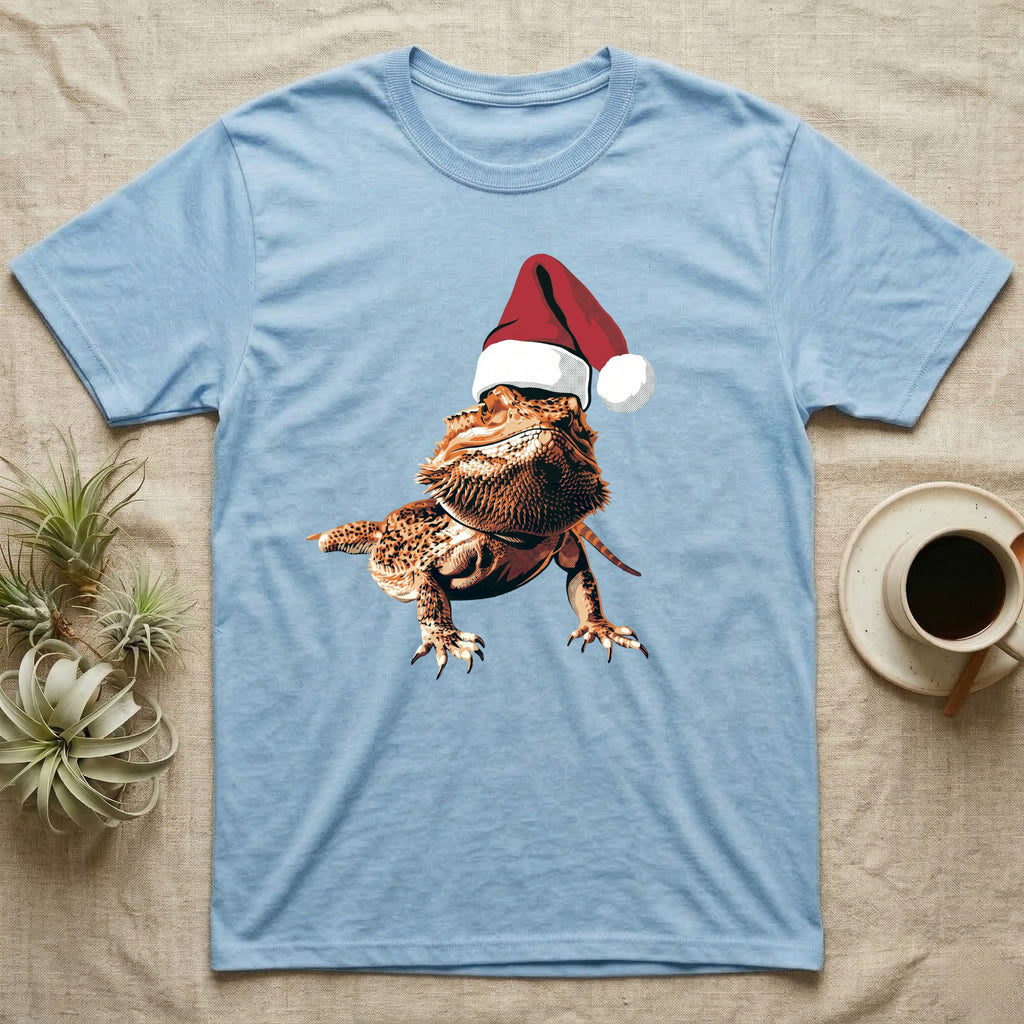 Vintage comic illustration of a bearded dragon wearing a red and white Santa hat, graphic-only, no text. — shown on a Light Blue tee.
