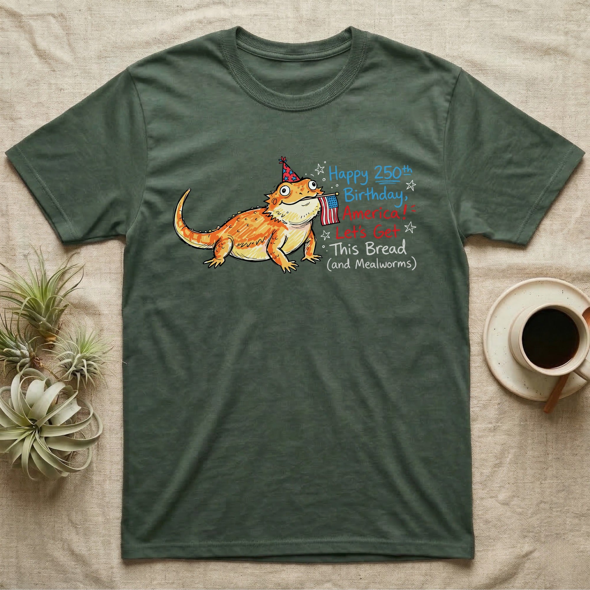 Bearded Dragon Birthday T-Shirt in Military Green — Sketch-style bearded dragon in a party hat holding a flag with handwritten text Happy 250th Birthday, America.