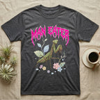 Chinese Mantis Feral T-Shirt in Dark Heather — Pastel Chinese mantis with raised spiked forelegs among leaves and blossoms, jagged magenta metal wordmark "MAN EATER" above.