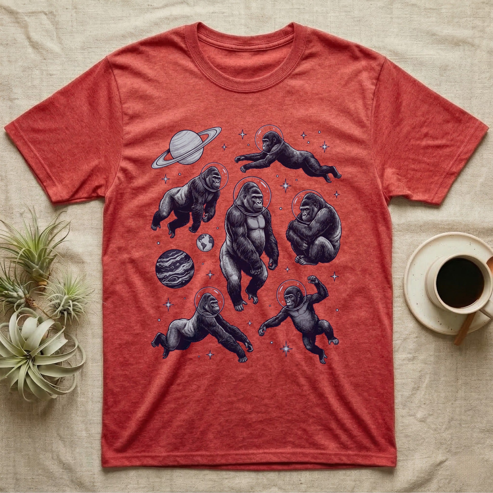 Red t-shirt with a repeating pattern of astronauts in space.