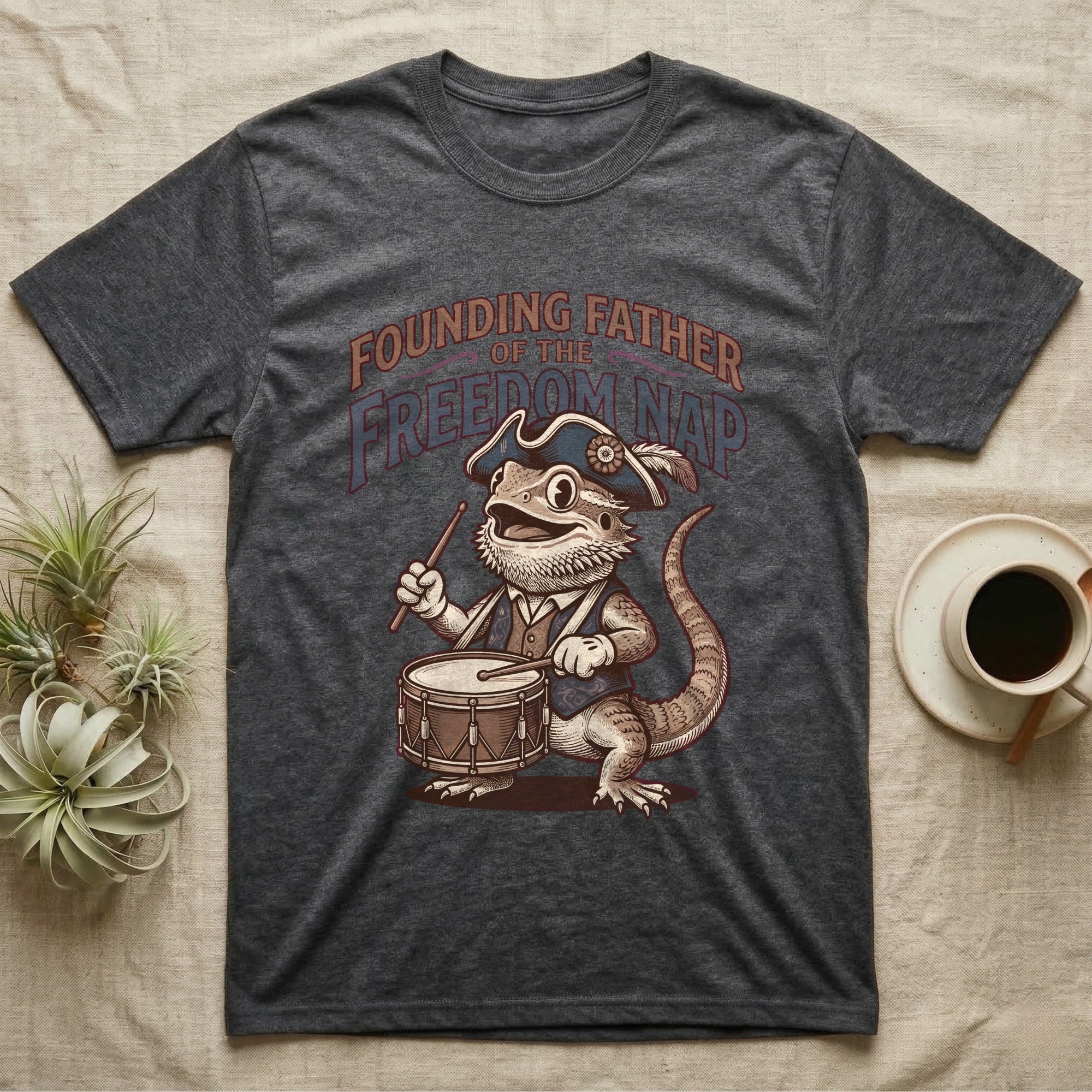 Bearded Dragon Drummer T-Shirt in Dark Heather — Sepia woodcut bearded dragon as a Revolutionary drummer boy under ornate text Founding Father of the Freedom Nap.