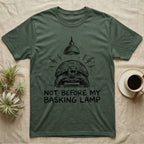 Russian Tortoise Mornings T-Shirt in Military Green — Charcoal drawing of a grumpy Russian tortoise yelling up at a basking lamp above the words NOT BEFORE MY BASKING LAMP.