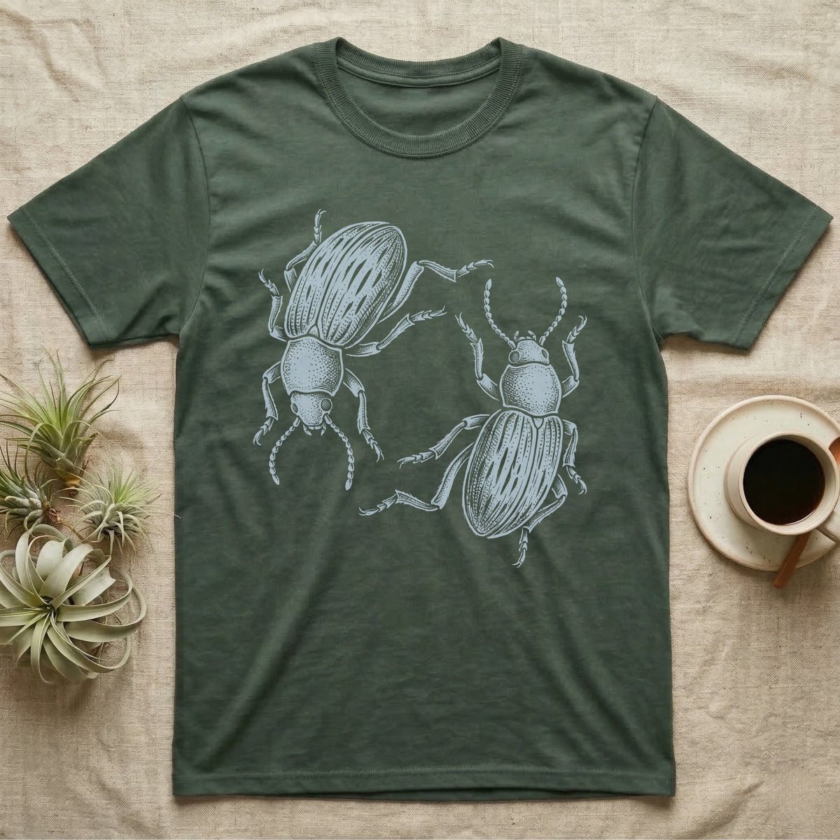 Death-Feigning Beetle Roundel T-Shirt in Military Green — Two blue death-feigning beetles in pale blue brush line art, rotated 180 degrees into a circle closed by their own bodies.