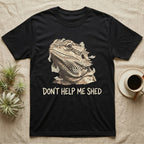 Don't Help Me Shed T-Shirt in Black — Retro-illustration of a bearded dragon mid-shed with a deadpan side-eye and a marker caption reading Don't Help Me Shed.