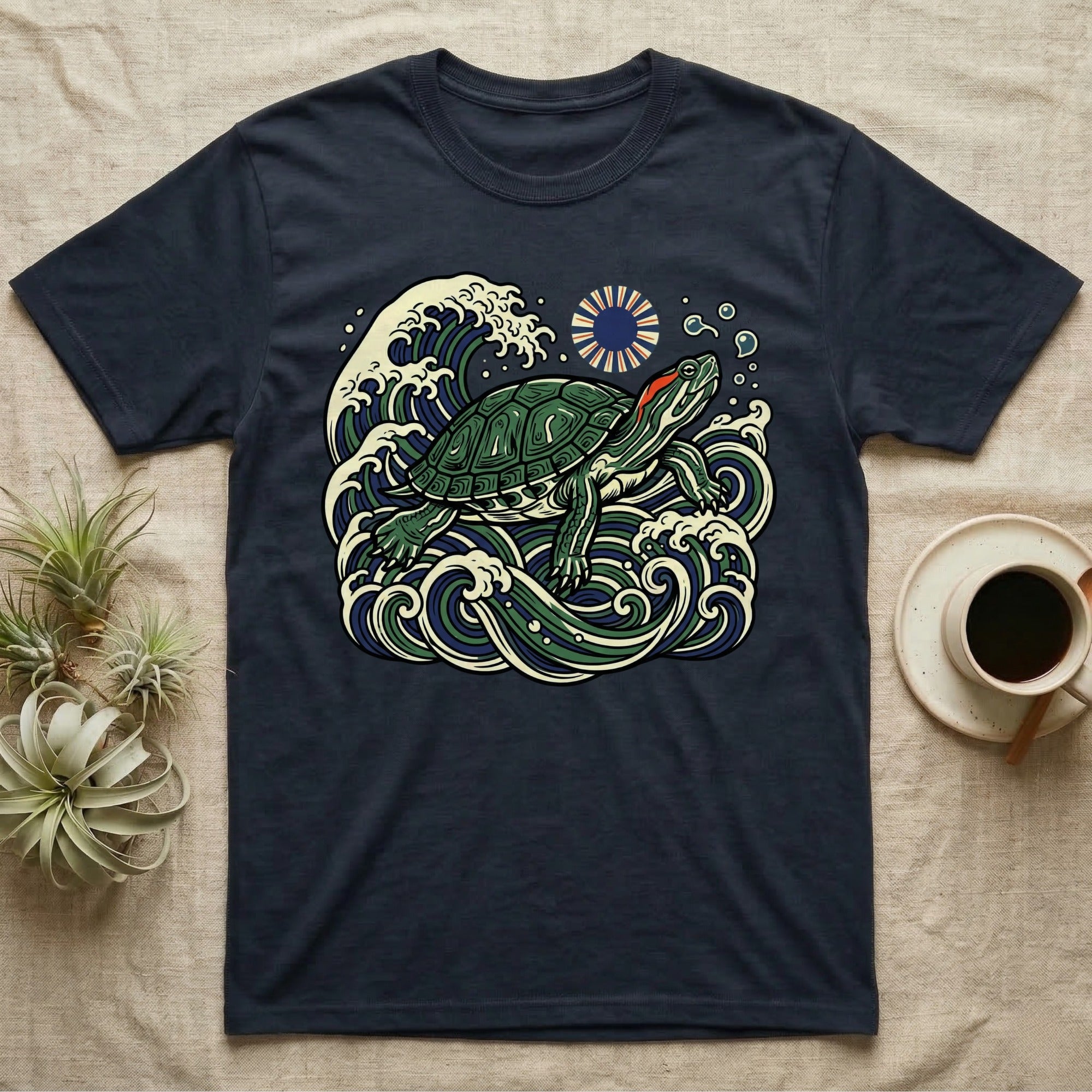 Turtle in ocean waves with sun graphic on navy t-shirt.