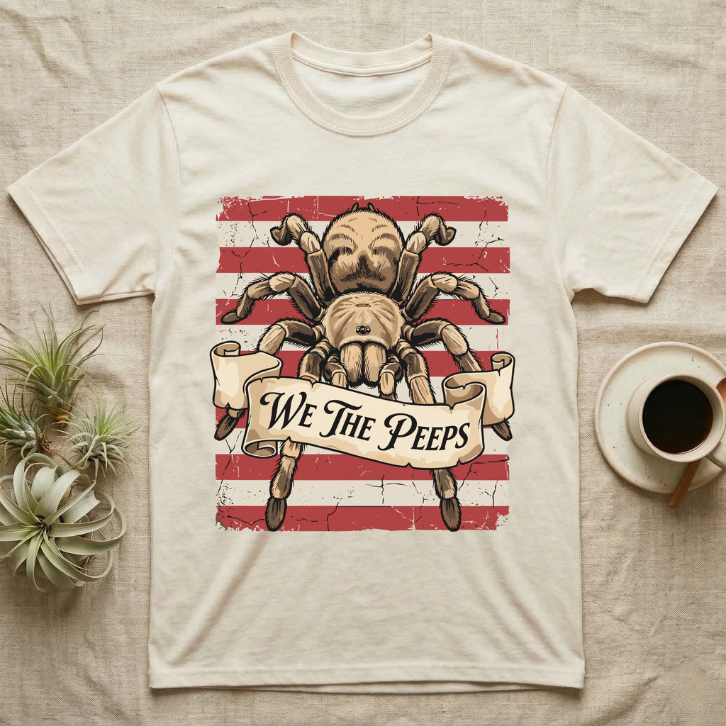 Tarantula We The Peeps T-Shirt in Natural — Detailed tarantula over a distressed striped flag holding a banner scroll reading We The Peeps.