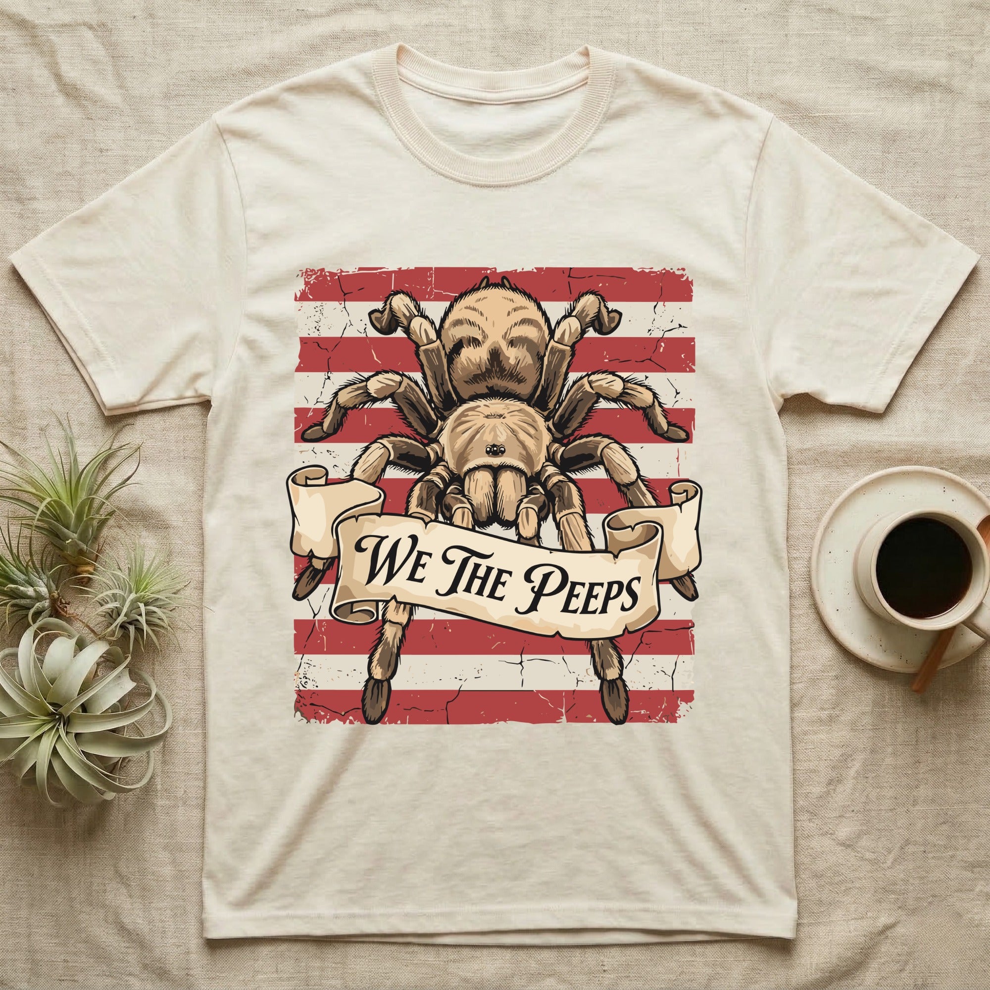 Tarantula We The Peeps T-Shirt in Natural — Detailed tarantula over a distressed striped flag holding a banner scroll reading We The Peeps.