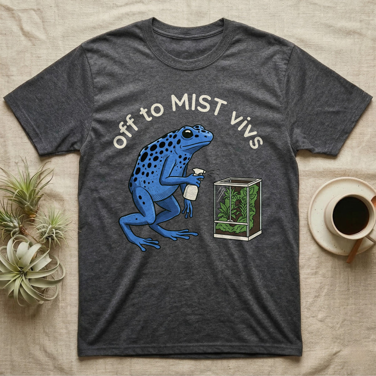 Dart Frog Misting T-Shirt in Dark Heather — Spotted blue dart frog spraying a planted vivarium under the words off to MIST vivs