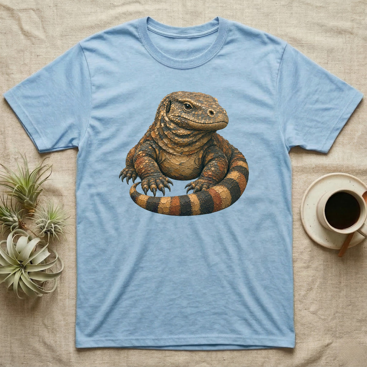 Light blue t-shirt with a detailed illustration of a Komodo dragon.