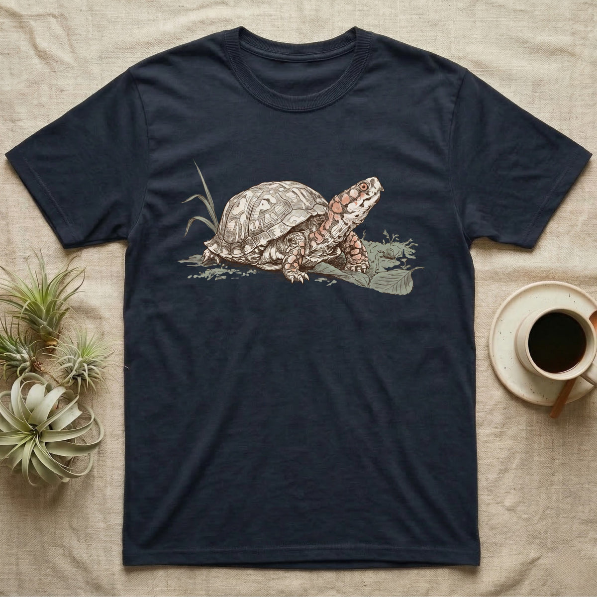 Box Turtle Shell T-Shirt in Navy — Naturalist-plate illustration of a box turtle with its shell shown as living body, above a serif welfare creed caption.