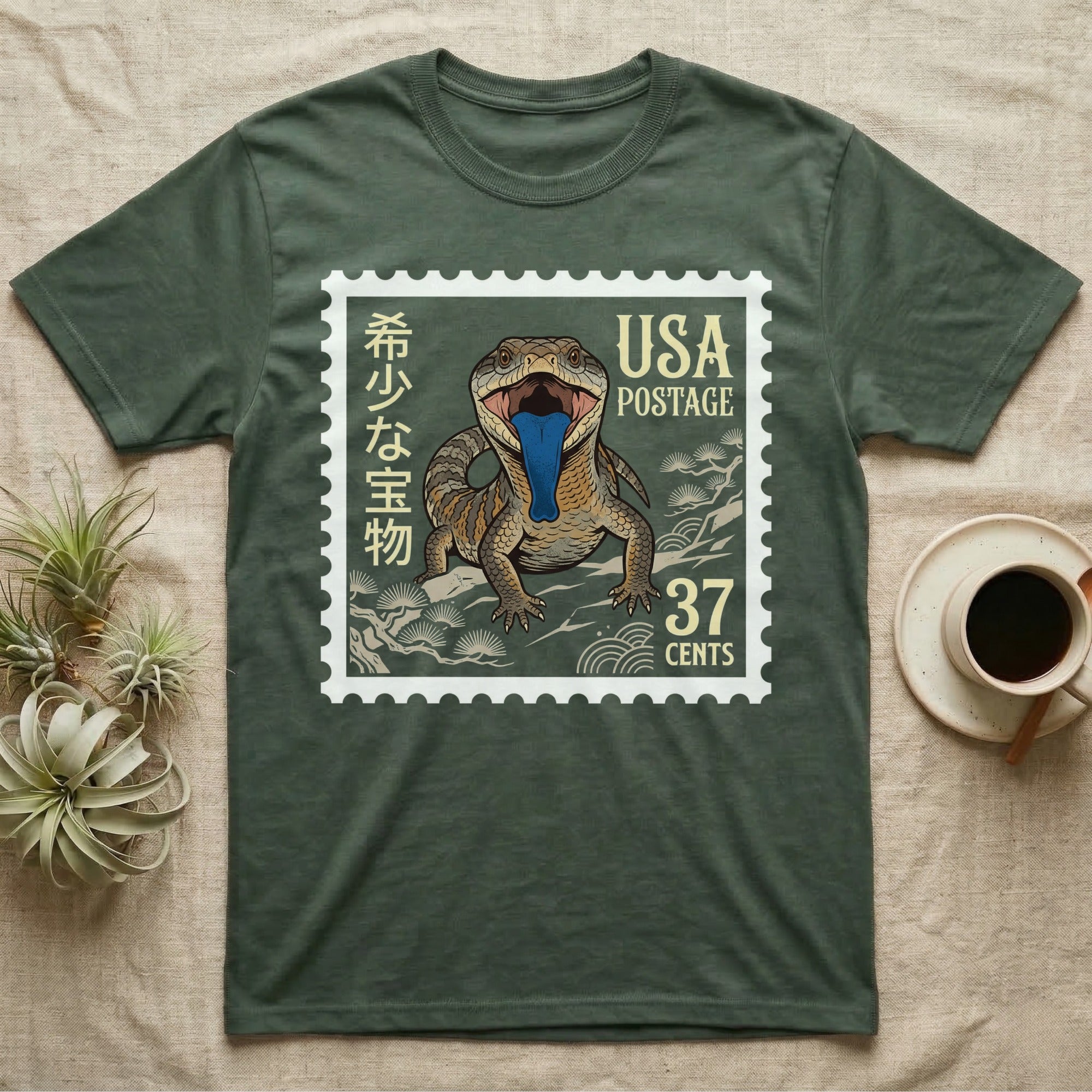 T-shirt with a stamp graphic featuring a lizard with a blue tongue and Japanese text.