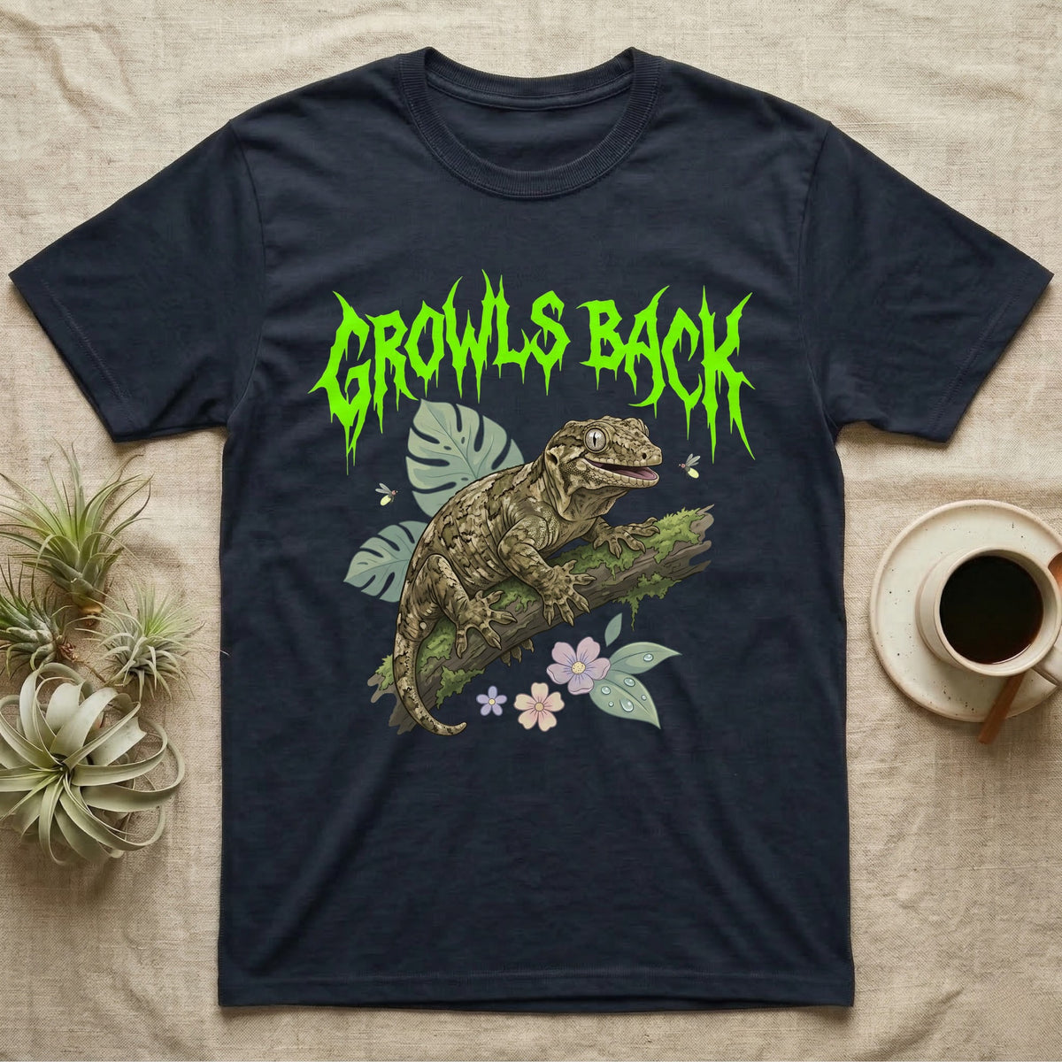 Leachianus Gecko Feral T-Shirt in Navy — Leachianus giant gecko on a mossy branch under jagged lime-green metal text GROWLS BACK with pastel leaves