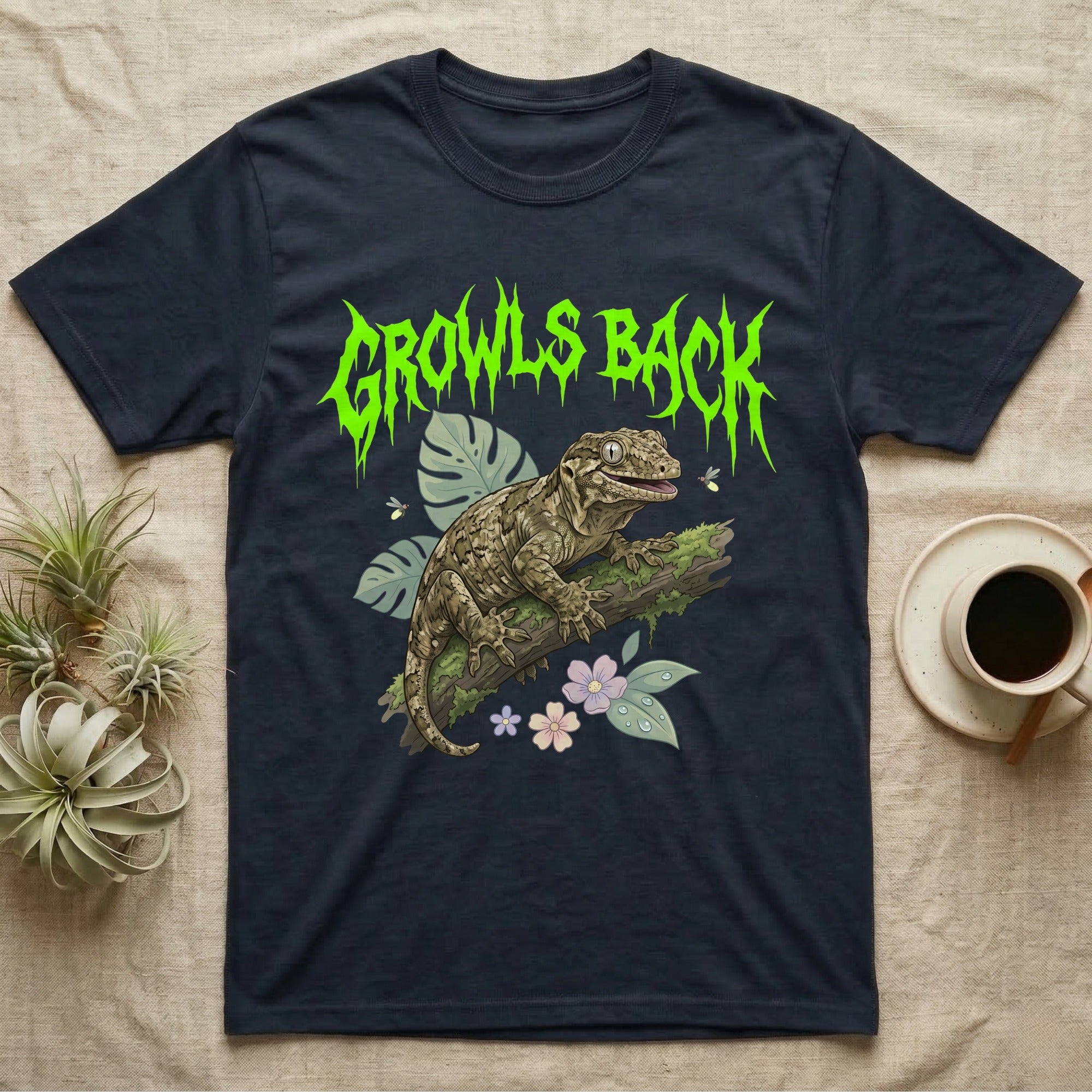 Leachianus Gecko Feral T-Shirt in Navy — Leachianus giant gecko on a mossy branch under jagged lime-green metal text GROWLS BACK with pastel leaves