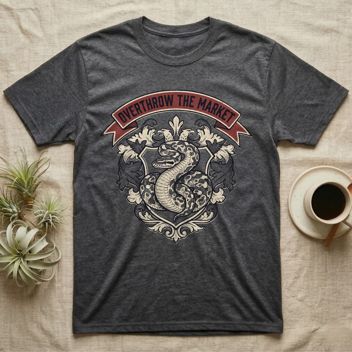 Overthrow The Market Python T-Shirt in Dark Heather — Vintage heraldic-crest illustration of a regal ball python with a banner reading "Overthrow The Market."
