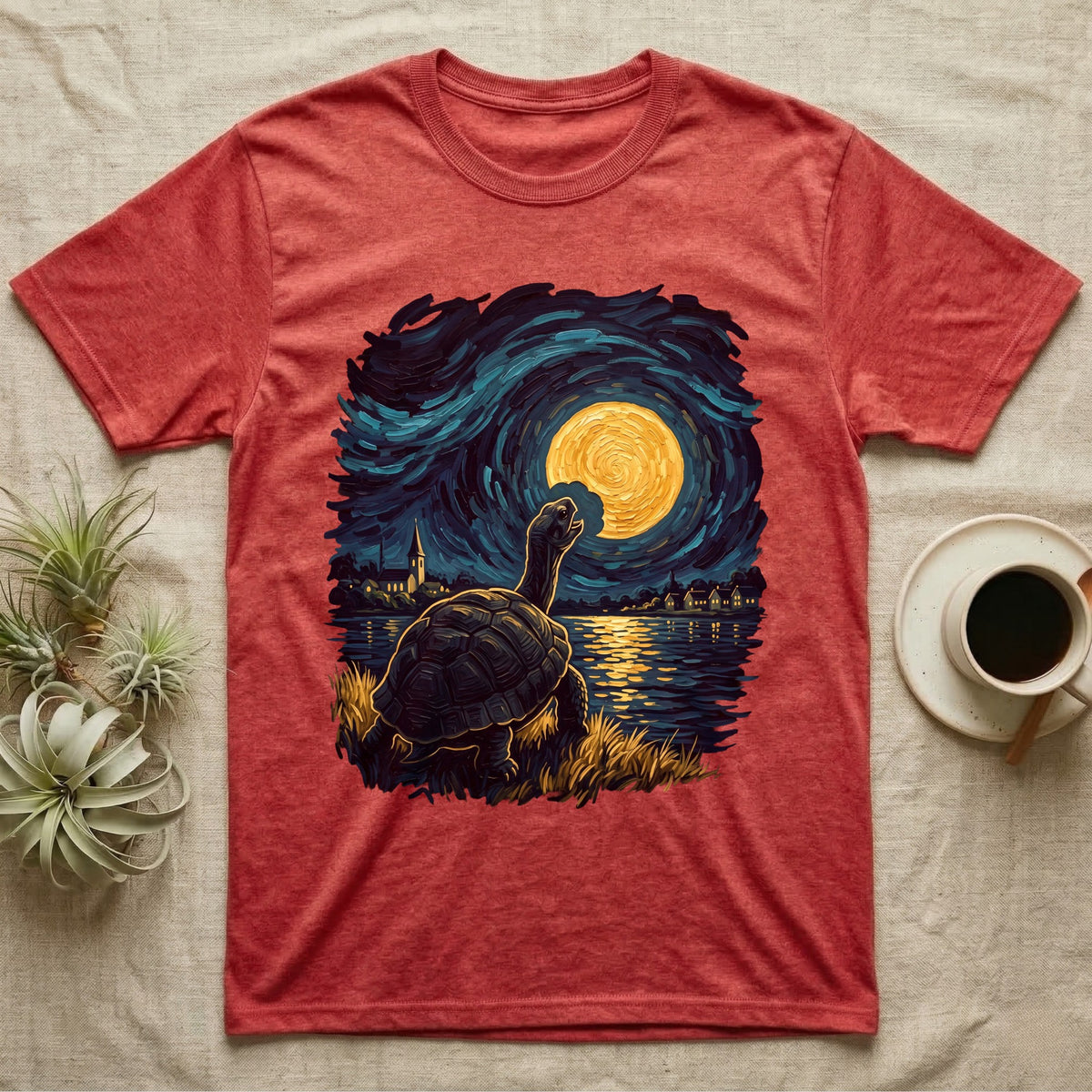 Hermann's Tortoise Moon T-Shirt in Heather Red — Painted Hermann's tortoise seen from behind, neck stretched up, biting a piece out of a golden spiral moon in a swirling blue night sky over a lake