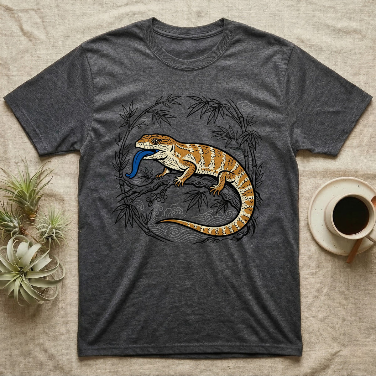 Dark grey t-shirt with a bearded dragon and bamboo branch graphic.