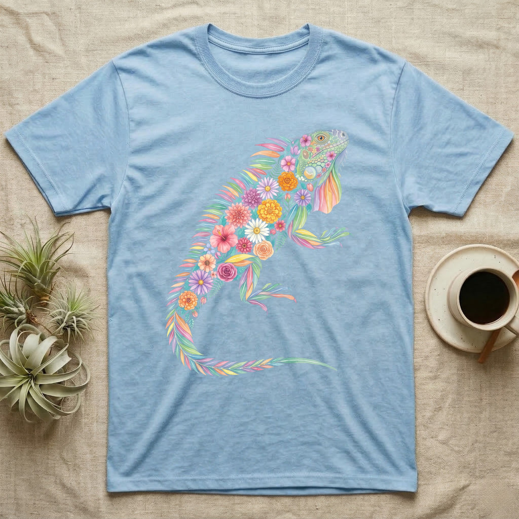 Green Iguana Floral Mosaic T-Shirt in Light Blue — Watercolour green iguana climbing, its whole body built from painted hibiscus, dandelion and leaf shapes.