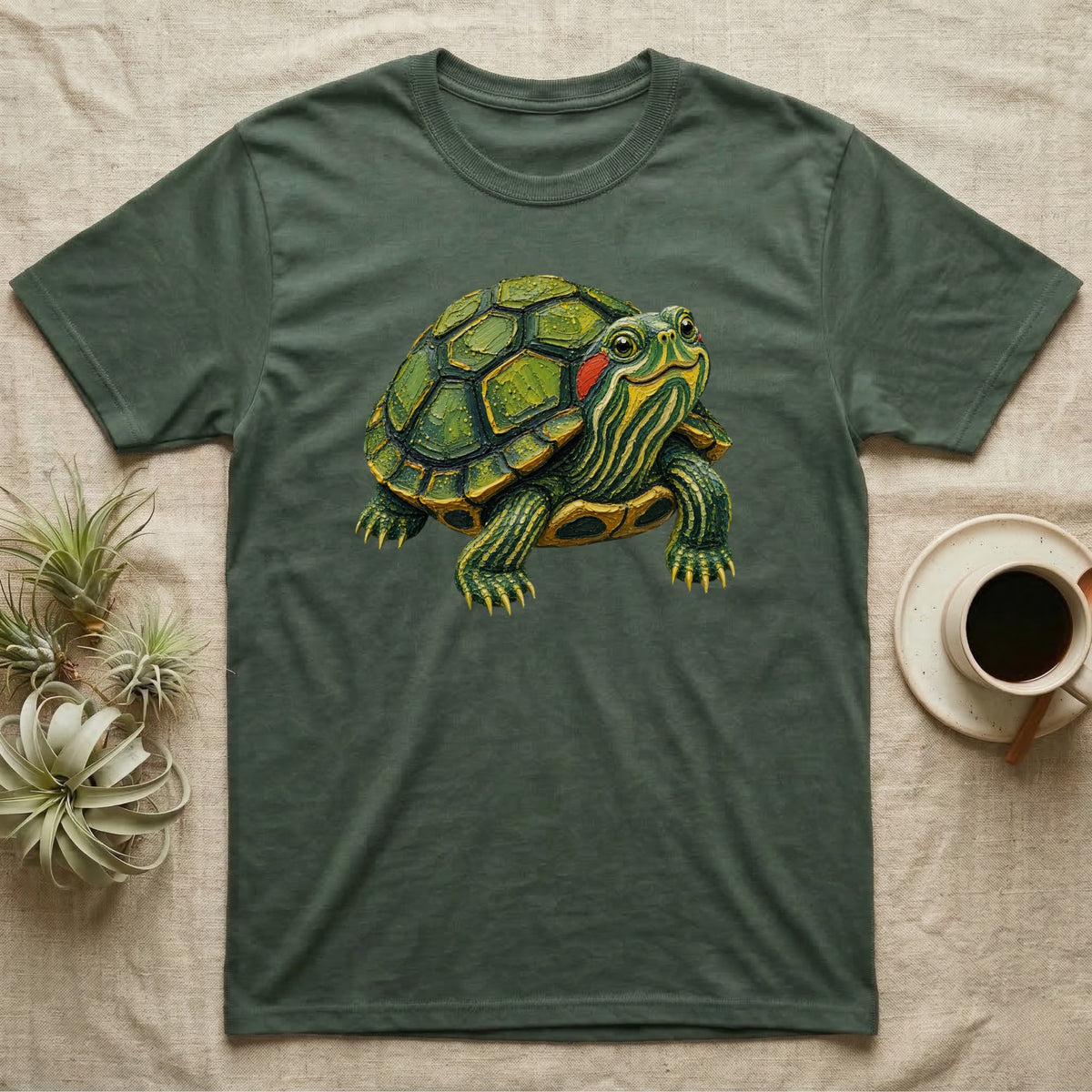Green t-shirt with a detailed illustration of a red-eared slider turtle.