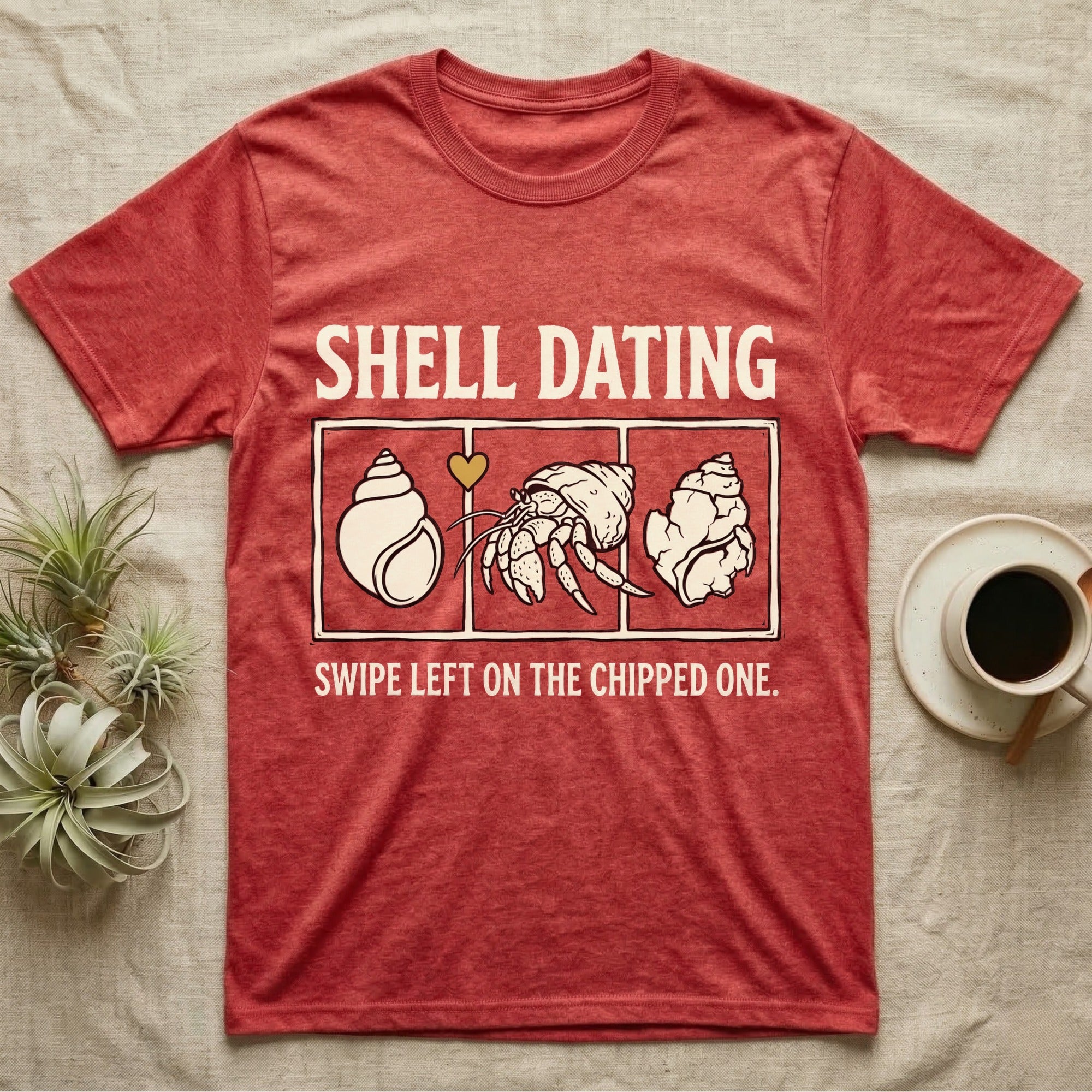 Hermit Crab Shell Dating T-Shirt in Heather Red — Vintage-ink hermit crab leaning toward a pristine shell, chipped shell on the right, carved type "Shell Dating. Swipe Left."