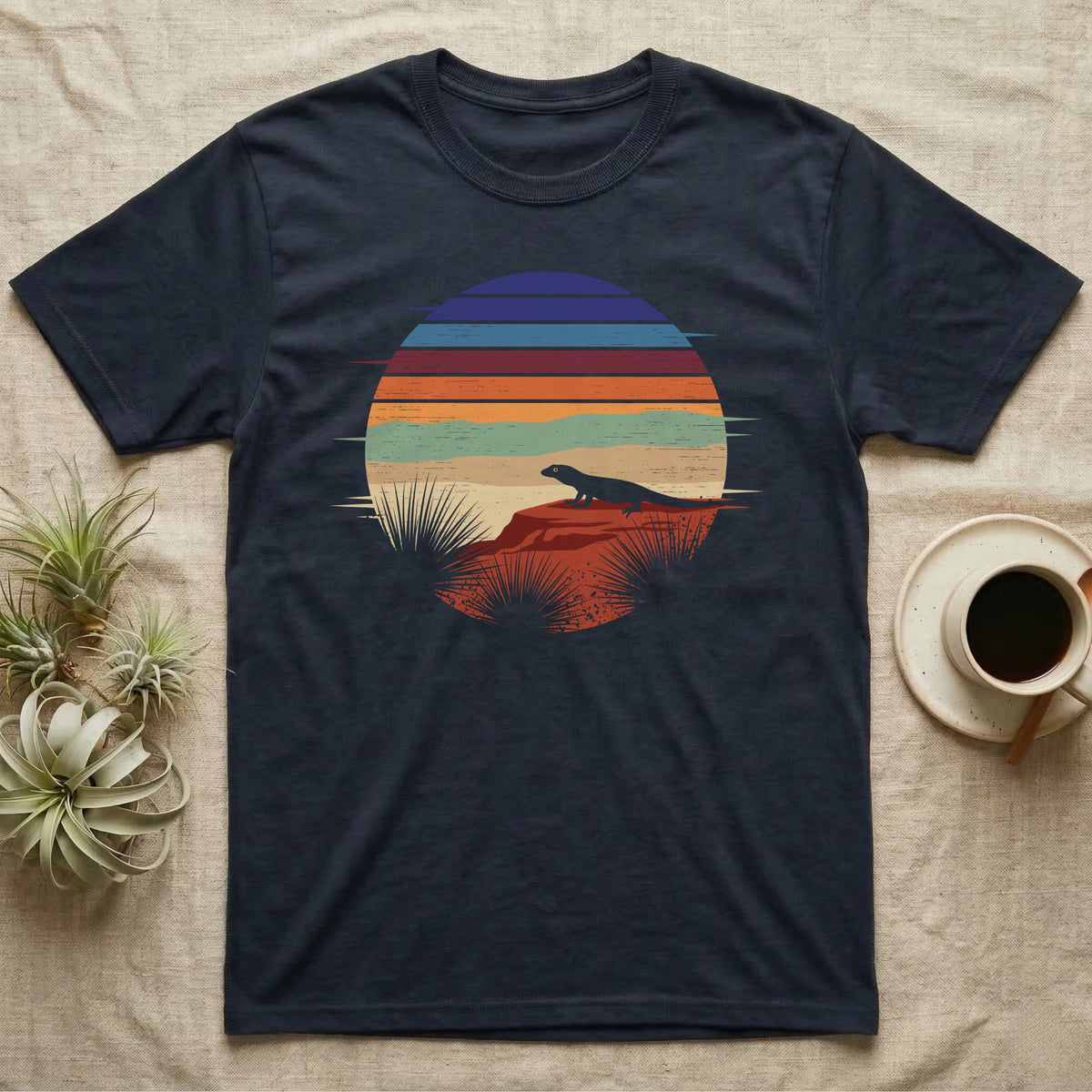 Ackie Monitor Night Window T-Shirt in Navy — Ackie monitor silhouetted on red rock inside a broken circular window of flat stepped desert night colour bands.